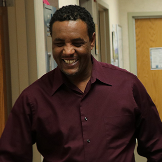 Denver Health patient Kemal Hebano smiles after getting his leg straightened