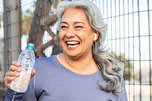 Woman drinking bottled water | Denver Health