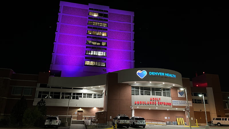 Purple lights illuminate Denver Health Pavilion A on Sixth Ave. and Bannock St. on Overdose Awareness Day.