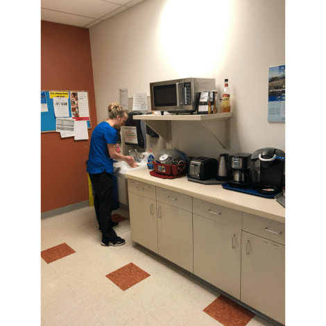 Denver Health staff member washing hands