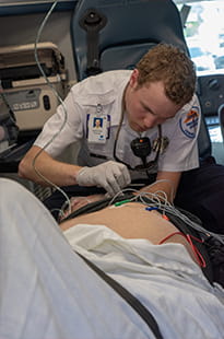 Denver Health Paramedic at work in ambulance
