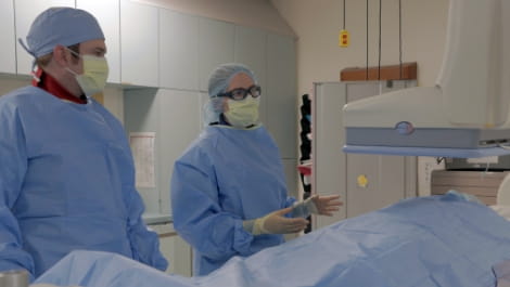 Interventional radiologists in procedure room