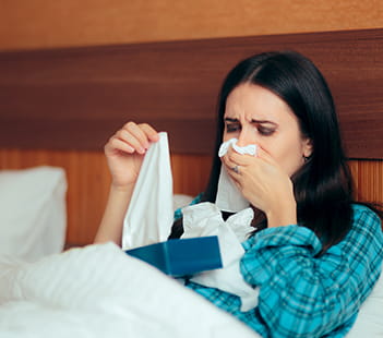 Cold home remedies woman sick in bed