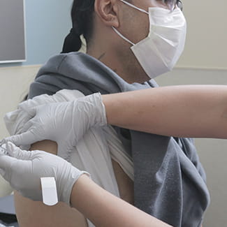 patient getting his flu shot at Denver Health's Sloan's Lake Primary Care Center