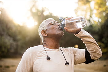 Man dehydrated in winter drinking water