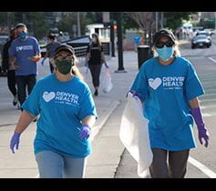 Denver Health Denver Health Foundation pick up trash volunteer on Denver streets