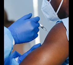 man getting coronavirus vaccine Denver Health