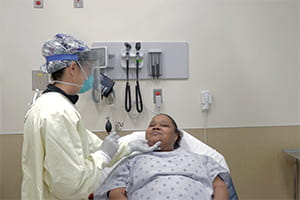 Doctor with Urgent Care patient Denver Health COVID-19 test