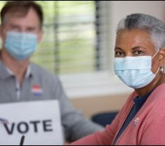 Woman at mobile voter registration at Denver Health