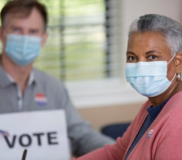 Woman at mobile voter registration at Denver Health