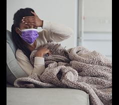 Woman feeling sick Denver Health COVID-19