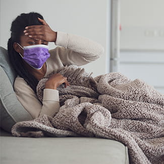 Woman feeling sick Denver Health COVID-19