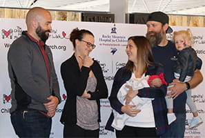 L-r: Denver Health paramedic James Boyer; Dr. Carolynn Francavilla Brown; Sarah, Hadley, Erik and Cameron Riggs