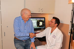 Denver Health patient Michael Rothschild and Denver Health director of Orthopedic Trauma and Research Cyril Mauffrey, M.D.