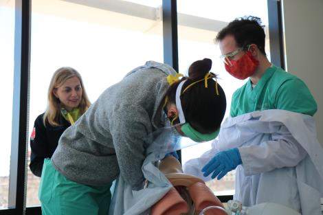 Doctor practicing intubating