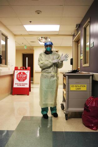 Resident suiting up in PPE