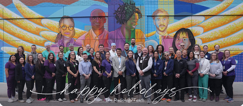 Radiology team poses for happy holidays greeting card photo
