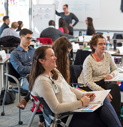 men and women in a classroom