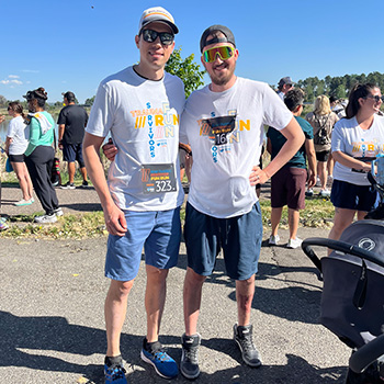 Dr. Hellwinkel stands with a patient at Berkeley Lake park