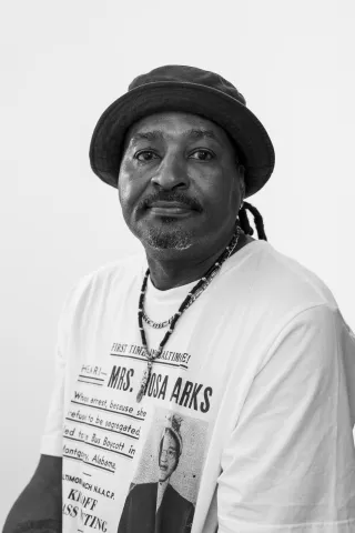 A portrait of Arnel in black and white