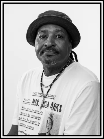 A black and white portrait of Arnel