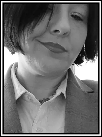 A black and white portrait of Kitty