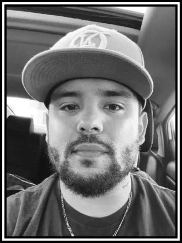A portrait of Conner in black and white