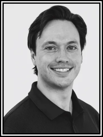 A portrait of Sam in black and white