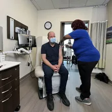 Governor Polis Receives Moderna COVID-19 Booster Vaccine at Denver Health