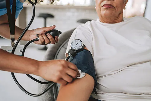 An iStock image of a woman having her blood pressure checked.