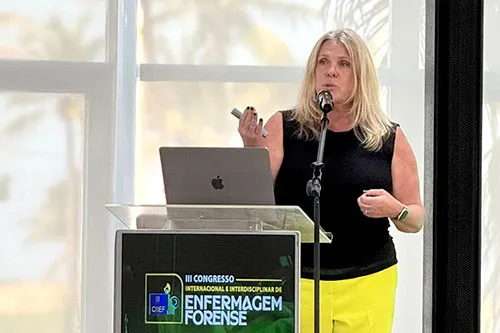 Michelle Metz, RN, program manager of the Sexual Assault Nurse Examiners unit, presents at a conference in Brazil